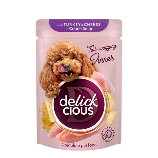 Delickcious™ „Juostelės su kalakutiena ir sūriu kreminėje sriuboje“. Visavertis konservuotas maistas suaugusiems šunims, 0,085 kg x 12