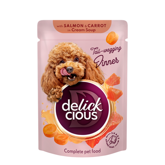 Delickcious™ „Juostelės su lašiša ir morkomis kreminėje sriuboje“. Visavertis konservuotas maistas suaugusiems šunims, 0,085 kg x 12